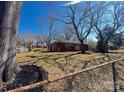 Cozy single-story home with a spacious yard, mature trees, and a partial fence at 926 Overhill St, Gastonia, NC 28052