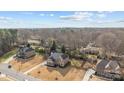 Aerial view of the houses and neighborhoods showcasing spacious lots and landscaping at 12515 Hashanli Pl, Matthews, NC 28105
