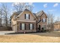 Lovely two story home with brick and siding, a two car garage and well maintained lawn at 12515 Hashanli Pl, Matthews, NC 28105