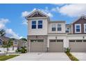 Lovely townhome with neutral colors, a spacious driveway, and appealing curb appeal at 14734 Tamarack Dr, Charlotte, NC 28278