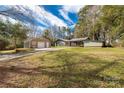 Aerial view showcasing the home, garage, covered parking, and the vast front yard at 1888 Usher Rd, Lancaster, SC 29720