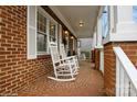 Relaxing front porch adorned with rocking chairs, perfect for enjoying quiet moments outdoors at 2125 Shenandoah Ave, Charlotte, NC 28205