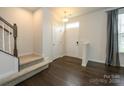 Inviting entryway with hardwood floors, carpeted stairs, and ample natural light at 2692 Norman Isle Dr, Denver, NC 28037