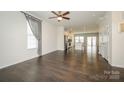 Open-concept living area with hardwood floors and seamless flow to the kitchen at 2692 Norman Isle Dr, Denver, NC 28037