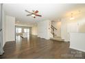 Spacious living room with hardwood floors, a ceiling fan, and staircase access at 2692 Norman Isle Dr, Denver, NC 28037