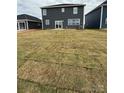 Expansive backyard with newly installed sod, providing ample space for outdoor activities at 330 Knotty Wood Dr # 67, Monroe, NC 28110