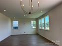 Open living room with hardwood floors, recessed lighting, and abundant natural light at 330 Knotty Wood Dr # 67, Monroe, NC 28110