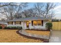Beautiful white brick home featuring modern updates and a well-kept front yard at 4531 Rockford Ct, Charlotte, NC 28209