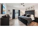 Serene main bedroom featuring hardwood floors, large window with curtains, and tasteful decor at 6509 Gopher Rd, Lancaster, SC 29720