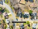 Aerial view of property, showing lot lines, surrounding neighborhood, mature trees, and proximity to nearby amenities at 8020 Harrington Woods Rd, Charlotte, NC 28269