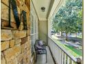 Cozy front porch featuring a bench seat and stone accents at 9409 Gilpatrick Ln, Huntersville, NC 28078