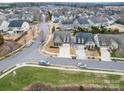 Residential street featuring well-maintained homes with mature landscaping and tree-lined streets at 105 Blossom Ridge Dr, Mooresville, NC 28117
