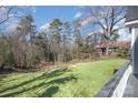 Scenic view of the home's backyard with lush green grass and surrounding trees at 116 Rose Ter, Wadesboro, NC 28170