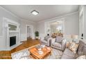 Cozy living room with hardwood floors, a fireplace, and neutral-toned furniture at 116 Rose Ter, Wadesboro, NC 28170