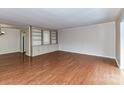 Spacious living room features hardwood floors and custom built-in bookshelves and cabinets at 1323 Queens Rd # 308, Charlotte, NC 28207