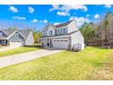 Charming two-story home featuring a welcoming front porch and a well-manicured lawn at 146 Allenton Way, Statesville, NC 28677