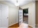 Inviting entryway showcasing hardwood floors and a glimpse of the exterior through an open front door at 1825 Hyatt Ave, Rock Hill, SC 29732
