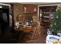 Cozy living room featuring a fireplace, hardwood floors, and vintage furniture at 2204 W Second Ave, Gastonia, NC 28052