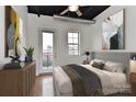Well-lit bedroom features a ceiling fan, a balcony door, and ample natural light at 2338 Yadkin Ave # 205, Charlotte, NC 28205