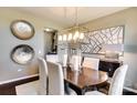 Elegant dining room features modern light fixture and decorative wall art at 3542 Rapport Ct # 37, Lancaster, SC 29720