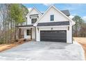 Charming new construction home with a dark garage door and inviting covered porch at 3646 46Th Ne Ave, Hickory, NC 28601
