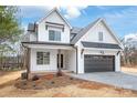 Charming two-story home featuring an attached garage, covered porch, and a manicured front yard at 3646 46Th Ne Ave, Hickory, NC 28601