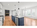 Modern kitchen with granite countertops, stainless steel appliances, and an island with pendant lighting at 3646 46Th Ne Ave, Hickory, NC 28601