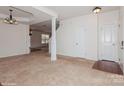 Spacious living room featuring neutral carpet, white walls, and decorative pillars at 420 Augustus Ln, Mount Holly, NC 28120