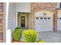 Charming townhome with a beautiful stone facade, a two-car garage and a cozy front porch at 510 Pine Links Dr, Tega Cay, SC 29708