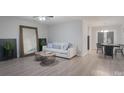 Bright living room featuring modern decor, a large mirror, and contemporary furniture at 7209 Tressel Ln, Mint Hill, NC 28227