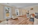 Spacious living room with hardwood floors, natural light, and a comfortable seating area at 9600 Mersham Ct, Charlotte, NC 28269