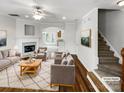 Bright living room featuring a fireplace, hardwood floors, and an open layout, perfect for entertaining and relaxing at 111 Charterhouse Ln, Fort Mill, SC 29715