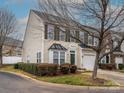Two-story townhouse with siding, shutters, landscaped front yard and a one-car garage at 120 Snead Rd, Fort Mill, SC 29715