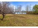 Spacious property featuring a single-story home with a detached carport, offering ample parking at 1691 Hopewell Church Rd, Catawba, NC 28609