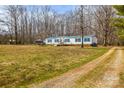 Single-story home set back on a expansive lot, offering privacy and room to roam at 1691 Hopewell Church Rd, Catawba, NC 28609