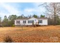 Charming single story home nestled on a serene lot, featuring a welcoming entrance and a cozy, inviting atmosphere at 1912 Beach Ln, Heath Springs, SC 29058