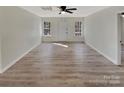 Bright and airy living room with neutral walls, and stylish flooring at 215 Creek View Rd, Mooresville, NC 28117
