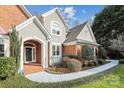 Welcoming front entry with brick accents and well-maintained landscaping at 3536 Wylie Meadow Ln, Charlotte, NC 28269