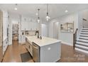 Spacious kitchen with an island, stainless steel appliances, and plenty of storage at 4159 Millstream Rd, Denver, NC 28037