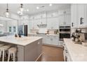 Beautiful kitchen boasting an island with seating, modern appliances, and custom cabinetry at 4159 Millstream Rd, Denver, NC 28037