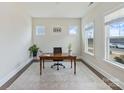 Bright office with natural light features neutral walls, plush rug, and a traditional wooden desk at 4159 Millstream Rd, Denver, NC 28037