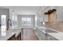 Spacious open-concept kitchen featuring hardwood floors and stainless steel appliances at 6055 Brush Crk, Monroe, NC 28110