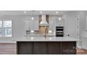 Modern kitchen with stone countertops, pendant lighting, and stainless steel double ovens at 6055 Brush Crk, Monroe, NC 28110