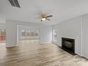 Spacious living room features hardwood floors, a fireplace, and large windows at 609 Sunset Point Dr, Rock Hill, SC 29732