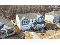 Lovely two-story home with a manicured lawn and driveway, captured from an aerial perspective at 7535 Meridale Forest Dr # 107, Charlotte, NC 28269