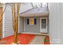 Inviting front entrance with cozy porch, neat landscaping with mulch, and a welcome mat at 11127 Sevilla Ct, Charlotte, NC 28226