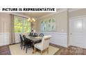 Elegant dining room with modern decor and lots of natural light at 117 Noah Ln, Troutman, NC 28166