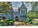 Charming home exterior with unique architecture, mature landscaping, and inviting entrance at 405 Northwest Dr, Davidson, NC 28036