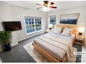 Cozy bedroom with a large window, neutral decor, and soft carpet, creating a relaxing atmosphere at 6409 Chadwell Ct, Fort Mill, SC 29707