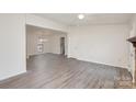 Spacious living room featuring updated flooring and abundant natural light at 8104 Tamalpais Ct, Charlotte, NC 28215